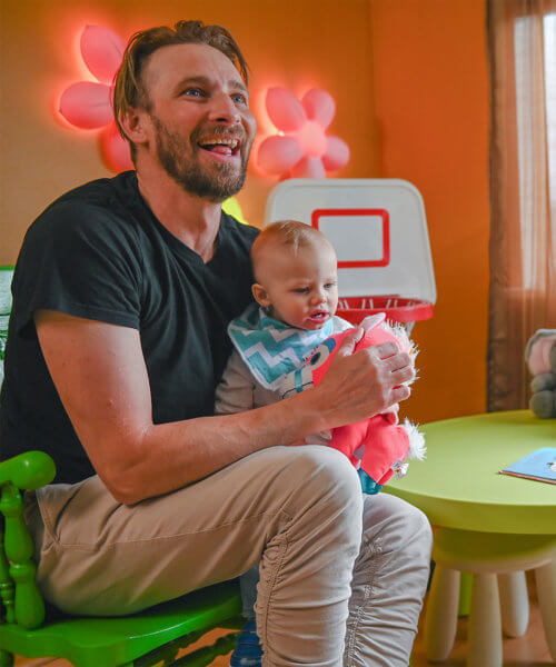 Last Door Fee Structure A father in recovery holding his son